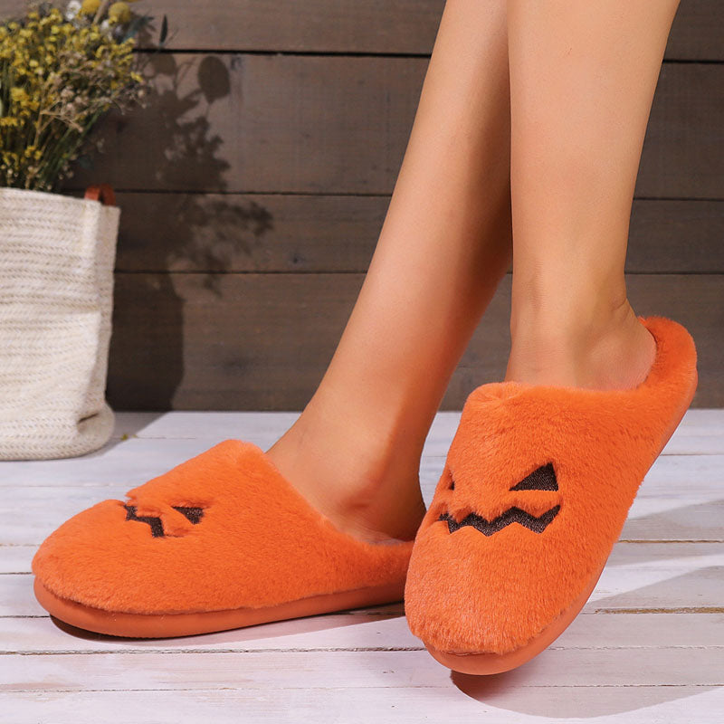 Pantofole in peluche con zucca di Halloween