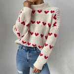 Suéter decretado en el corazón tejido